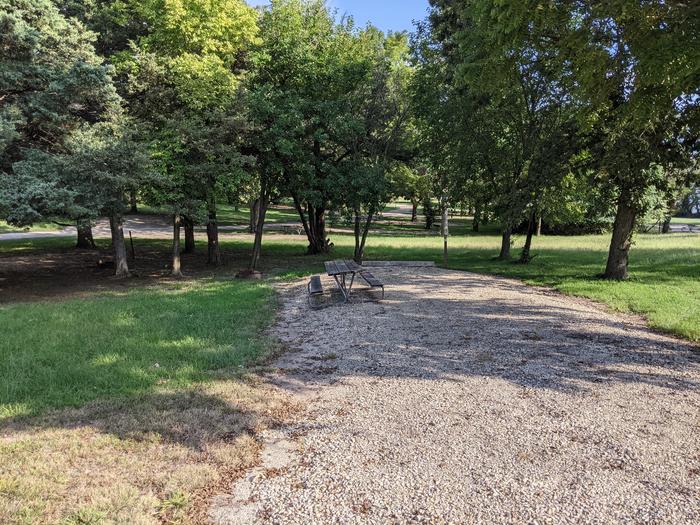 A photo of Site 7 of Loop A at Timber Creek Park with Picnic Table, Fire Pit, Shade