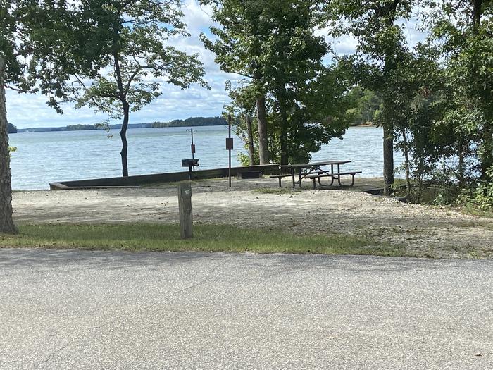 A photo of Site 13 of Loop SPRINGFIELD  at SPRINGFIELD with Picnic Table, Electricity Hookup, Fire Pit, Shade, Tent Pad, Waterfront, Lantern Pole, Water Hookup