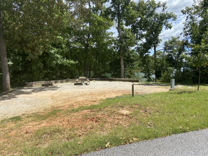 A photo of Site 76 of Loop SPRINGFIELD  at SPRINGFIELD with Picnic Table, Electricity Hookup, Fire Pit, Shade, Tent Pad, Waterfront, Lantern Pole, Water Hookup