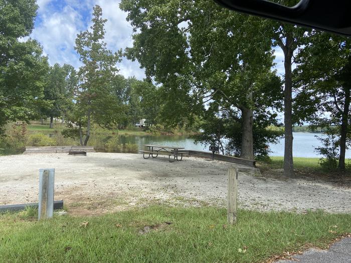 A photo of Site 46 of Loop SPRINGFIELD  at SPRINGFIELD with Picnic Table, Electricity Hookup, Fire Pit, Shade, Tent Pad, Waterfront, Lantern Pole, Water Hookup