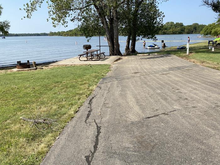 A photo of Site 007 of Loop RCOV at RICHEY COVE with Picnic Table, Electricity Hookup, Fire Pit, Waterfront, Water Hookup