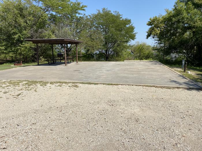 A photo of Site 004 of Loop SFET at SANTA FE TRAIL with Picnic Table, Electricity Hookup, Fire Pit, Shade, Waterfront, Water Hookup