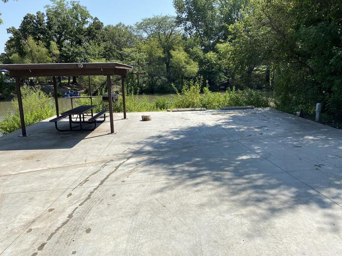 A photo of Site 010 of Loop SFET at SANTA FE TRAIL with Picnic Table, Electricity Hookup, Fire Pit, Shade, Waterfront, Water Hookup