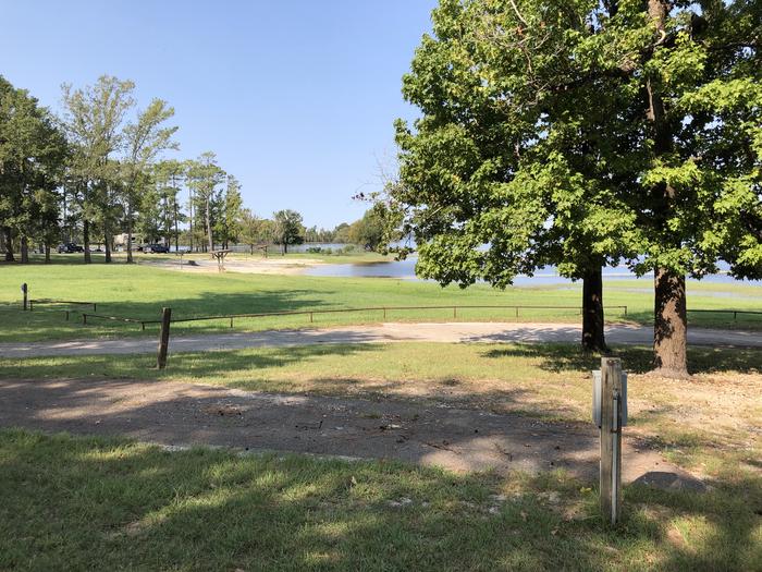 A photo of Site 075 of Loop C at MILL CREEK (TEXAS) with Picnic Table, Electricity Hookup, Fire Pit, Waterfront, Lantern Pole, Water Hookup