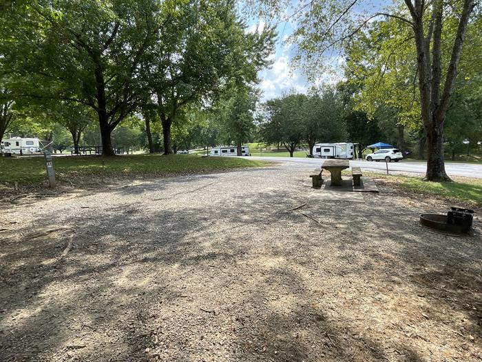 A photo of Site 028 of Loop HILL at DEFEATED CREEK PARK with Picnic Table, Electricity Hookup, Fire Pit, Shade, Water Hookup