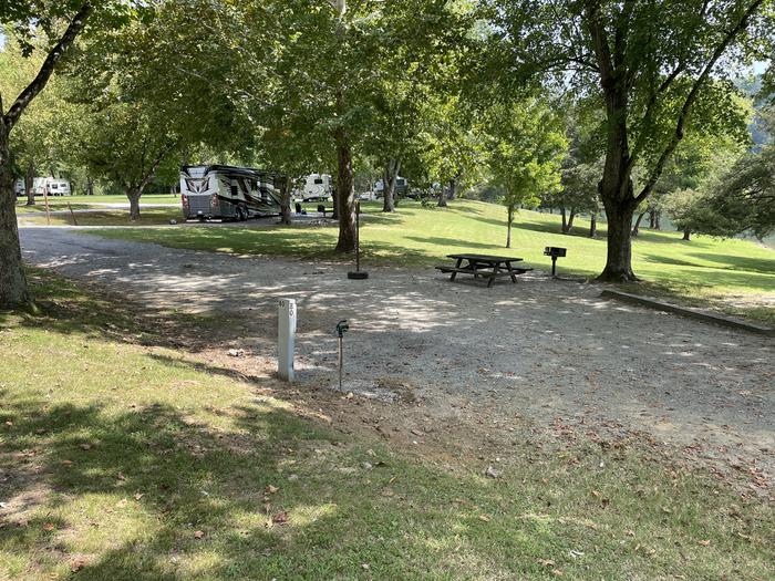 A photo of Site 080 of Loop LAKE at DEFEATED CREEK PARK with Picnic Table, Electricity Hookup, Fire Pit, Shade, Waterfront, Lantern Pole, Water Hookup