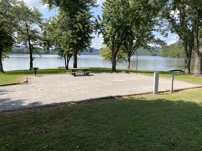 A photo of Site 012 of Loop LAKE at DEFEATED CREEK PARK with Picnic Table, Electricity Hookup, Fire Pit, Waterfront, Lantern Pole, Water Hookup