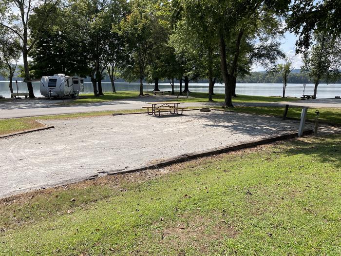 A photo of Site 019 of Loop LAKE at DEFEATED CREEK PARK with Picnic Table, Electricity Hookup, Fire Pit, Shade, Water Hookup
