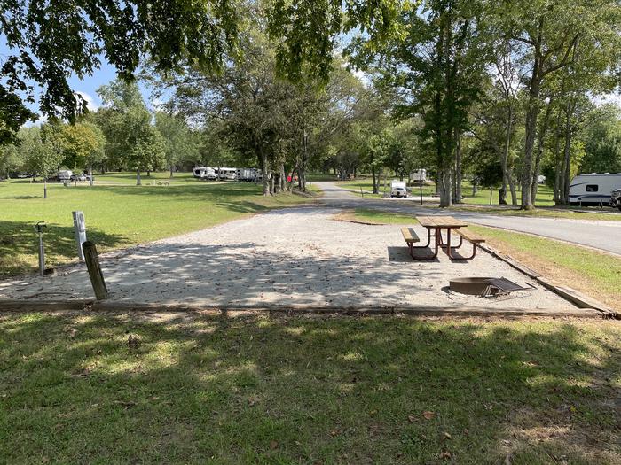 A photo of Site 019 of Loop LAKE at DEFEATED CREEK PARK with Picnic Table, Electricity Hookup, Fire Pit, Shade, Water Hookup