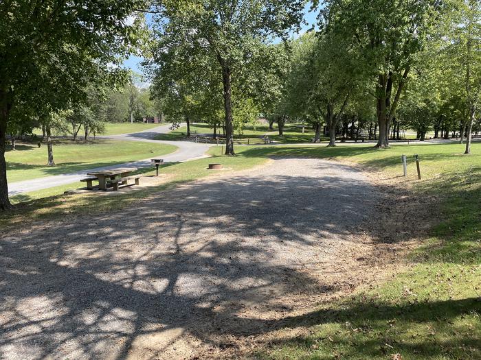 A photo of Site 034 of Loop LAKE at DEFEATED CREEK PARK with Picnic Table, Electricity Hookup, Fire Pit, Shade, Water Hookup
