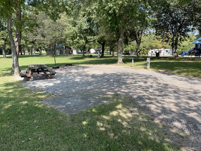 A photo of Site 070 of Loop LAKE at DEFEATED CREEK PARK with Picnic Table, Electricity Hookup, Fire Pit, Shade, Lantern Pole, Water Hookup