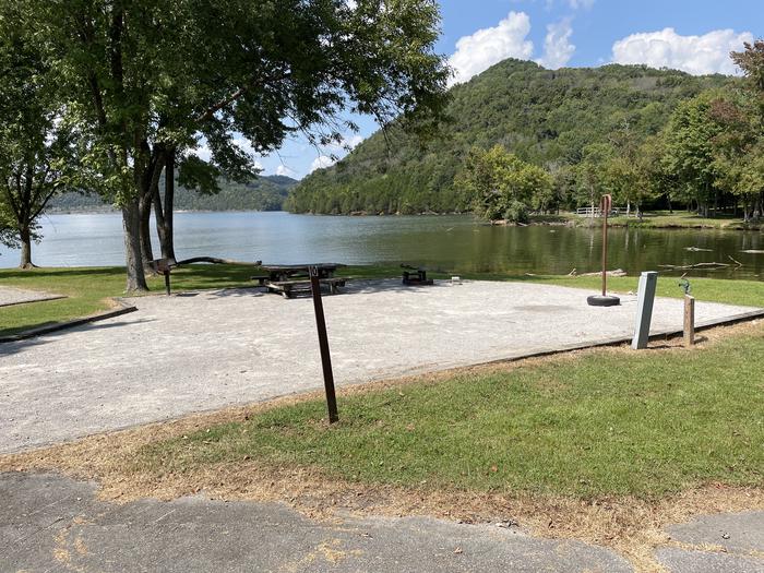 A photo of Site 010 of Loop LAKE at DEFEATED CREEK PARK with Picnic Table, Electricity Hookup, Fire Pit, Waterfront, Lantern Pole, Water Hookup