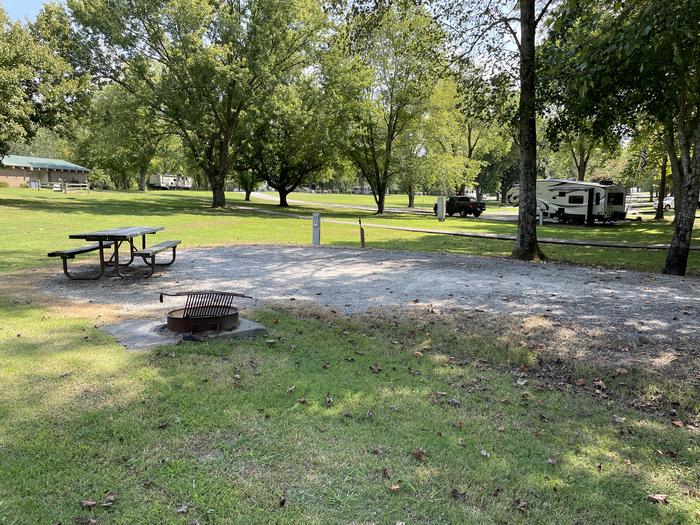 A photo of Site 033 of Loop HONE at DEFEATED CREEK PARK with Picnic Table, Electricity Hookup, Fire Pit, Shade, Water Hookup