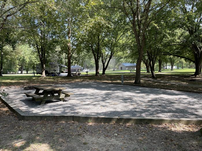 A photo of Site 058 of Loop LAKE at DEFEATED CREEK PARK with Picnic Table, Electricity Hookup, Fire Pit, Shade, Water Hookup