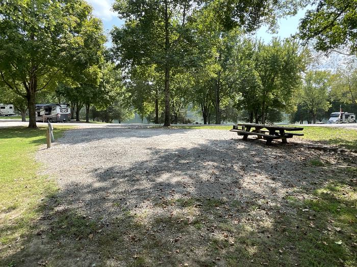 A photo of Site 081 of Loop LAKE at DEFEATED CREEK PARK with Picnic Table, Electricity Hookup, Fire Pit, Shade, Water Hookup