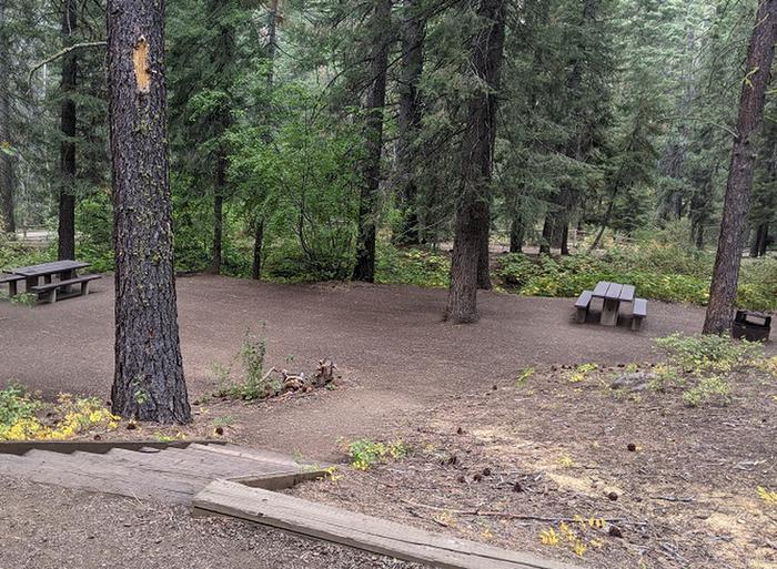 Picnic tables for sites 3 and 5 are adjacent to each other, and may be accessed by short stairway from each site.Picnic table and fire ring for site 5 shown on the right. Picnic table and fire ring for site 3 on the far left of photo.