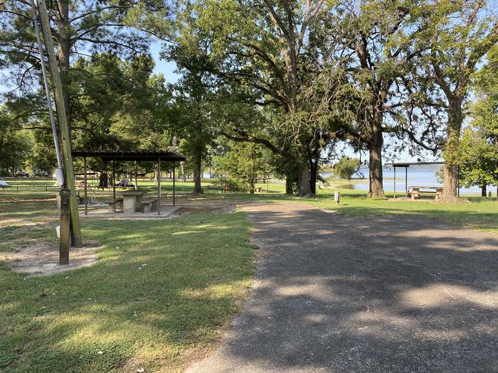 A photo of Site 071 of Loop C at MILL CREEK (TEXAS) with Picnic Table, Electricity Hookup, Fire Pit, Shade, Lantern Pole, Water Hookup, Lean To / Shelter