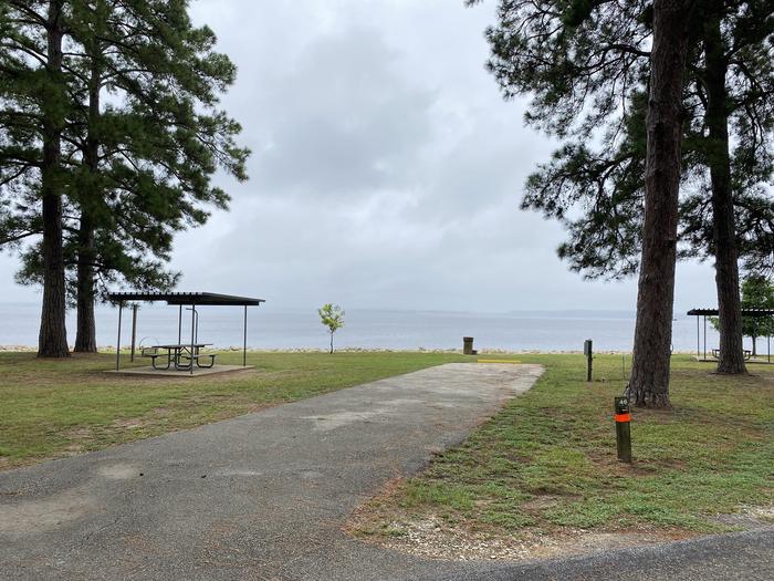 A photo of Site 46 of Loop LOOB at RAYBURN with Picnic Table, Electricity Hookup, Fire Pit, Waterfront, Lantern Pole, Water Hookup, Lean To / Shelter