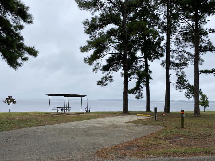 A photo of Site 43 of Loop LOOB at RAYBURN with Picnic Table, Electricity Hookup, Fire Pit, Shade, Waterfront, Lantern Pole, Water Hookup, Lean To / Shelter