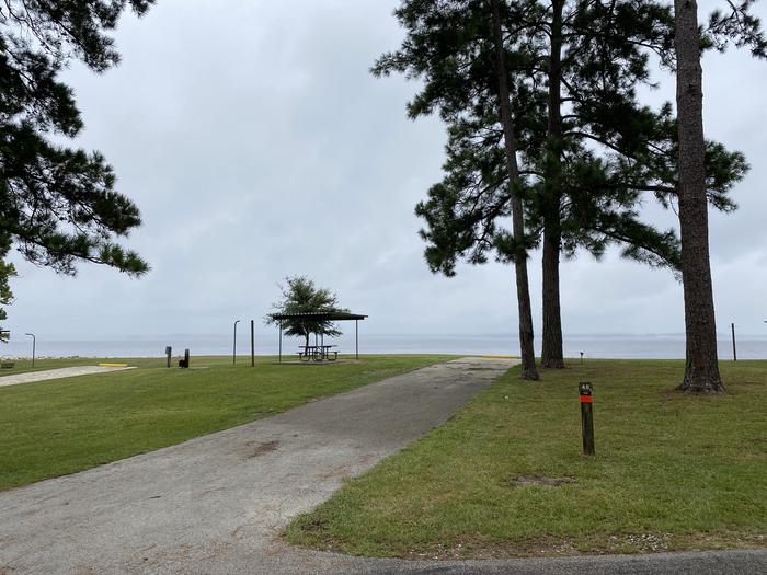 A photo of Site 48 of Loop LOOB at RAYBURN with Picnic Table, Electricity Hookup, Fire Pit, Waterfront, Lantern Pole, Water Hookup, Lean To / Shelter