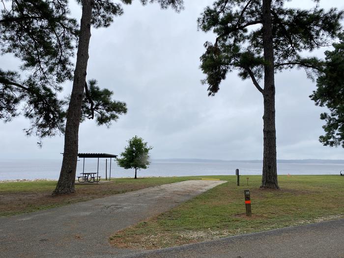 A photo of Site 45 of Loop LOOB at RAYBURN with Picnic Table, Electricity Hookup, Fire Pit, Shade, Waterfront, Lantern Pole, Water Hookup, Lean To / Shelter