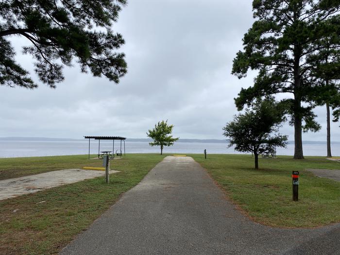 A photo of Site 41 of Loop LOOB at RAYBURN with Picnic Table, Electricity Hookup, Fire Pit, Waterfront, Lantern Pole, Water Hookup, Lean To / Shelter