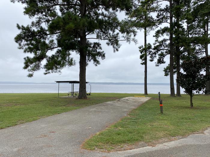 A photo of Site 40 of Loop LOOB at RAYBURN with Picnic Table, Electricity Hookup, Fire Pit, Shade, Waterfront, Lantern Pole, Water Hookup, Lean To / Shelter
