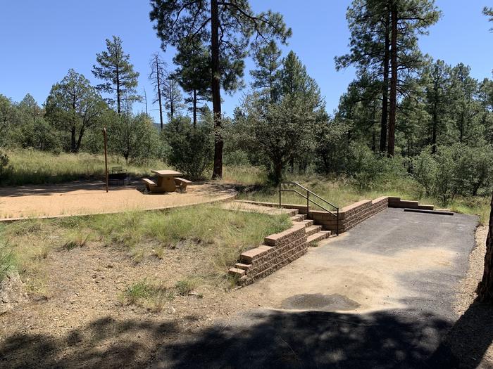 A photo of Site 17 of Loop D at LYNX CAMPGROUND with Picnic Table, Fire Pit, Lantern Pole. View of back-in parking. 5 steps to campsite. 