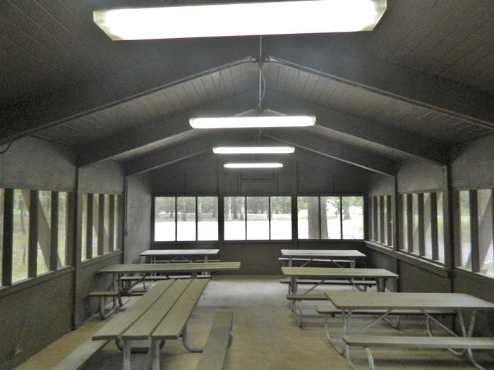 Merrisach Lake - B Loop Group Shelter - InteriorEquipped with 4 overhead lights, and indoor picnic tables.
Equipped with 360° bug screen.