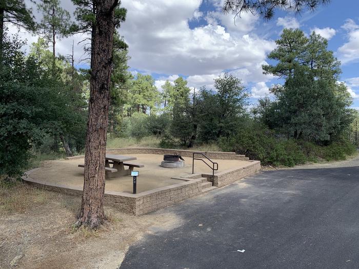 A photo of Site 28 of Loop G at LYNX CAMPGROUND with Picnic Table, Fire Pit and curbside parking. A photo of Site 28 of Loop G at LYNX CAMPGROUND with Picnic Table, Fire Pit and curbside parking with 4 steps up to campsite. 