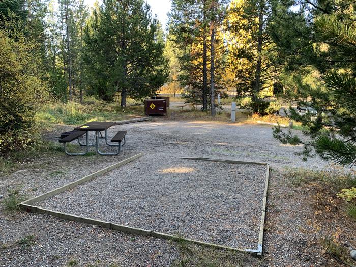 A photo of Site 3 of Loop 1 at Signal Mountain Lodge Campground with Picnic Table, Electricity Hookup, Fire Pit, Shade, Food Storage, Tent Pad