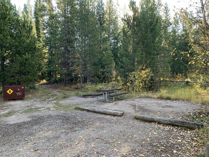 A photo of Site 2 of Loop 1 at Signal Mountain Lodge Campground with Picnic Table, Electricity Hookup, Fire Pit, Shade, Food Storage, Tent Pad