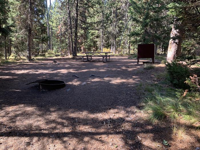 A photo of Site 18 of Loop Main Road at Lizard Creek Campground with Picnic Table, Fire Pit, Shade, Food Storage