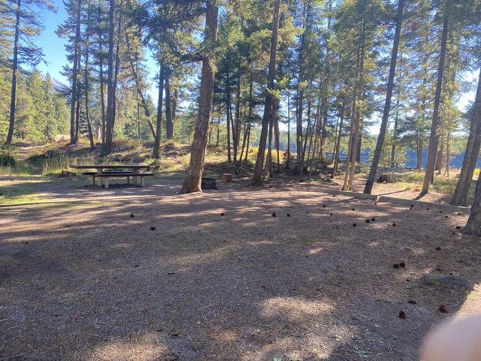 A photo of Site 021 of Loop C - BAY at HOLLAND LAKE CAMPGROUND with Picnic Table, Fire Pit, Waterfront
