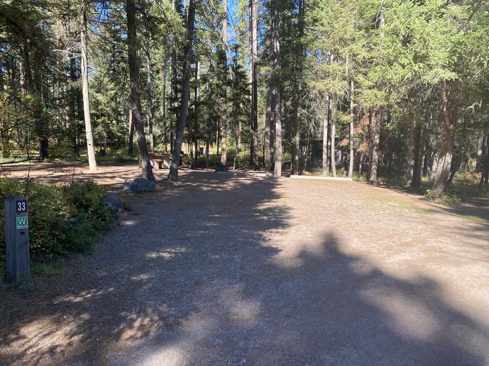 A photo of Site 033 of Loop C - BAY at HOLLAND LAKE CAMPGROUND with Picnic Table, Fire Pit