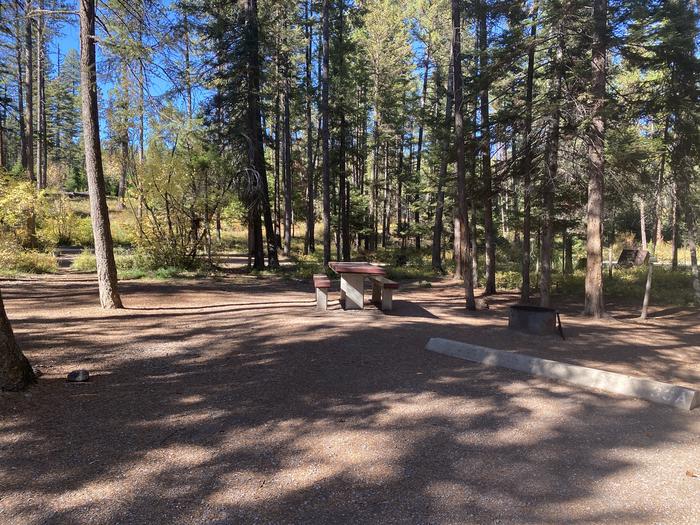 A photo of Site 033 of Loop C - BAY at HOLLAND LAKE CAMPGROUND with Picnic Table, Fire Pit