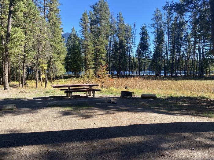 A photo of Site 034 of Loop C - BAY at HOLLAND LAKE CAMPGROUND with Picnic Table, Fire Pit