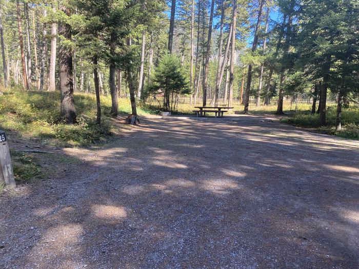 A photo of Site 025 of Loop C - BAY at HOLLAND LAKE CAMPGROUND with Picnic Table, Fire Pit