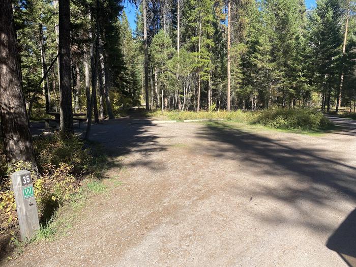 A photo of Site 035 of Loop C - BAY at HOLLAND LAKE CAMPGROUND with Picnic Table, Fire Pit