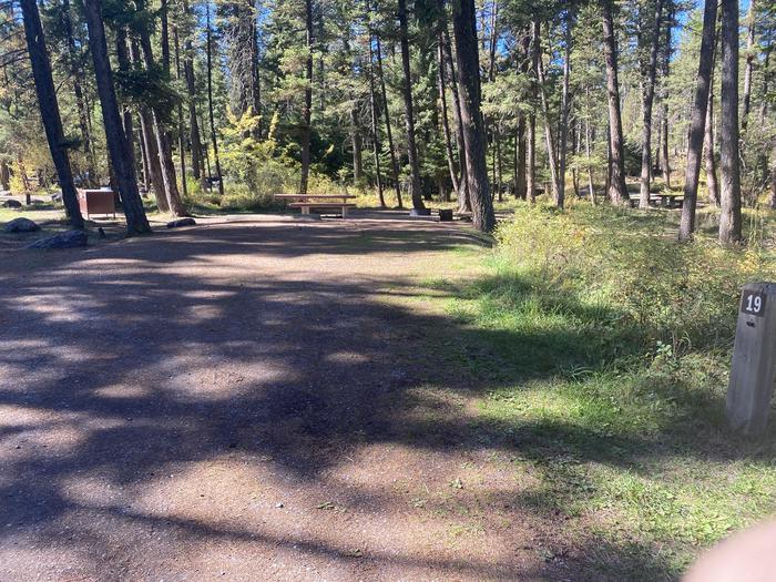 A photo of Site 019 of Loop C - BAY at HOLLAND LAKE CAMPGROUND with Picnic Table, Fire Pit