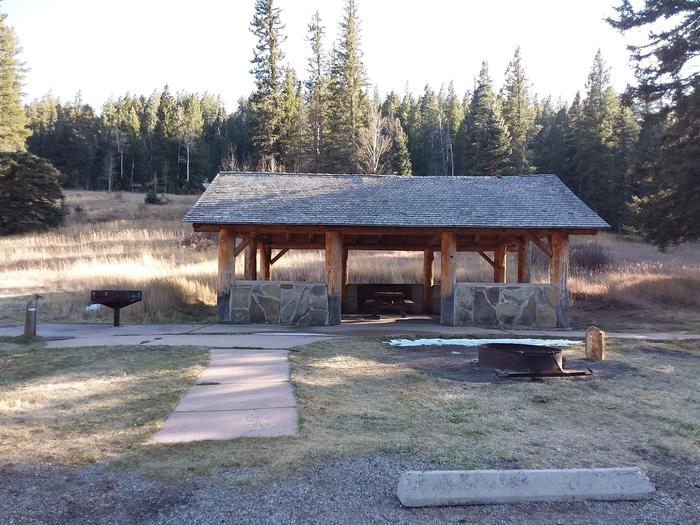 Group Shelter B with gazebo as well as a picnic table, campfire ring, grill, water spout and paved sidewalk
