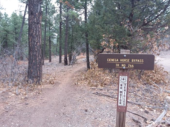 Sign for Cienega trail No. 266 and path.Cienega trail No. 266