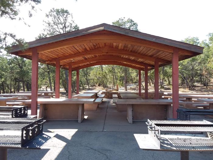 Cedro Peak Jay Campsite Pavilion with multiple picnic tables and grills