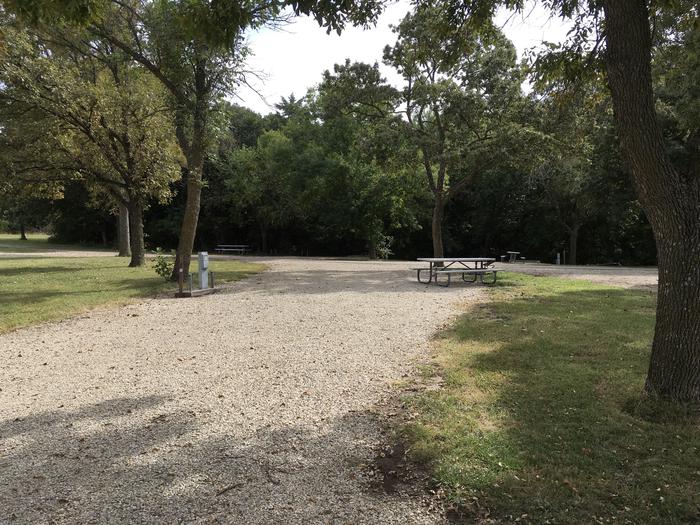 A photo of Site A001 of Loop A Loop at FARNUM CREEK with Picnic Table, Electricity Hookup, Fire Pit, Shade, Water Hookup. Able tto pull straight through.