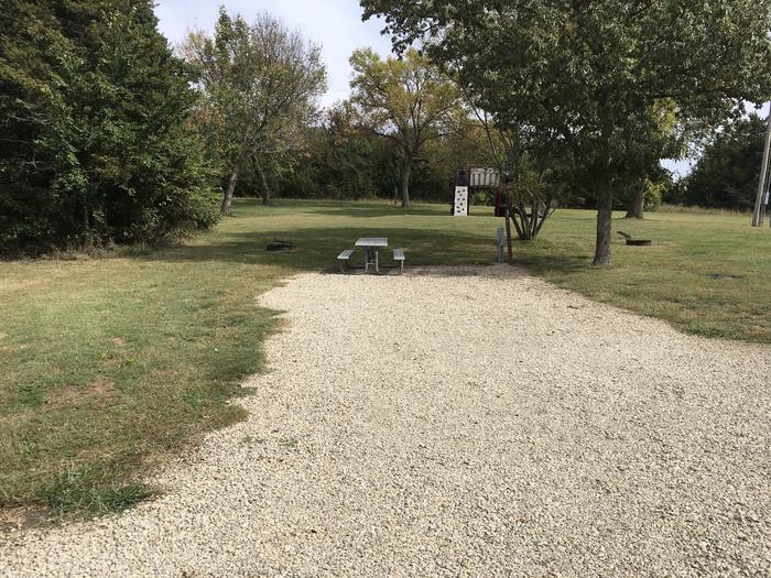 A photo of Site A007 of Loop A Loop at FARNUM CREEK with Picnic Table, Electricity Hookup, Fire Pit, Shade, Water Hookup. Right by playground.