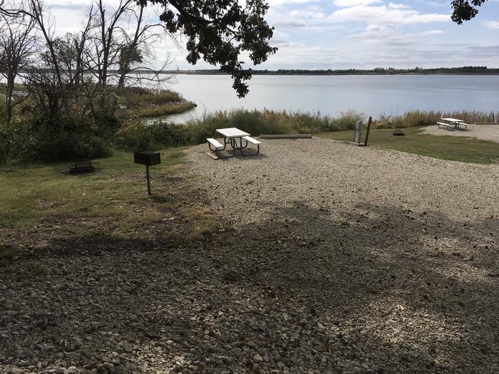 A photo of Site A030 of Loop A Loop at FARNUM CREEK with Picnic Table, Electricity Hookup, Fire Pit, Shade, Waterfront, Water Hookup