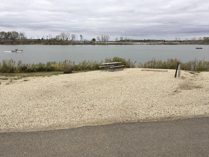 A photo of Site A020 of Loop A Loop at FARNUM CREEK with Picnic Table, Electricity Hookup, Fire Pit, Waterfront, Water Hookup