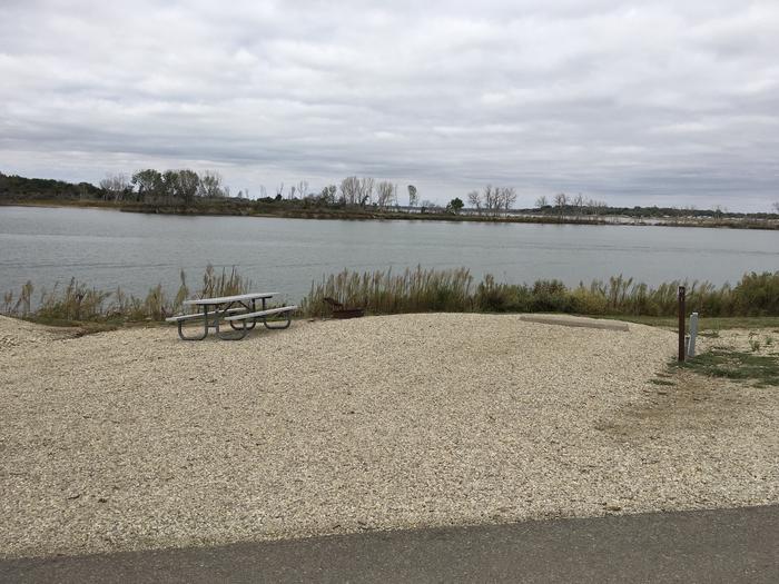 A photo of Site A021 of Loop A Loop at FARNUM CREEK with Picnic Table, Electricity Hookup, Fire Pit, Waterfront, Water Hookup