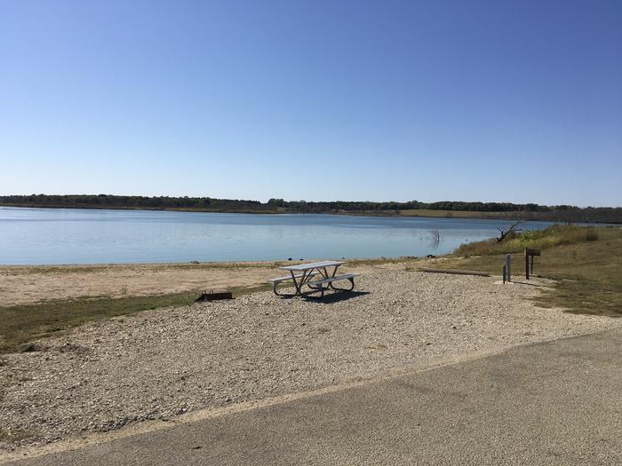 A photo of Site C020 of Loop C at CURTIS CREEK with Picnic Table, Electricity Hookup, Fire Pit, Waterfront, Water Hookup
