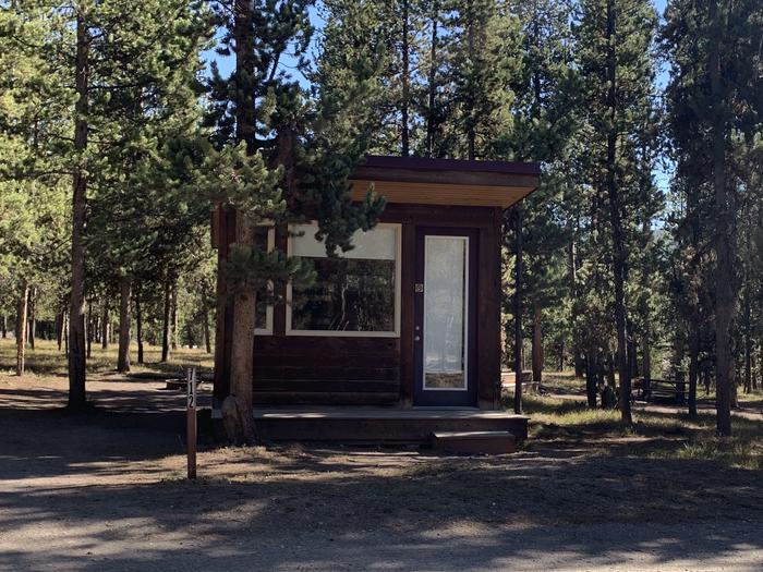 A photo of Site 712 of Loop 700s at Headwaters Campground at Flagg Ranch with Picnic Table, Fire Pit